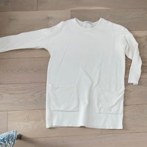 Zara mini dress with front pockets size medium. White .